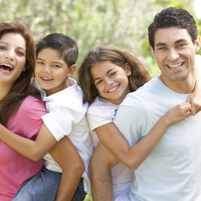 Portrait of Happy Family In Park